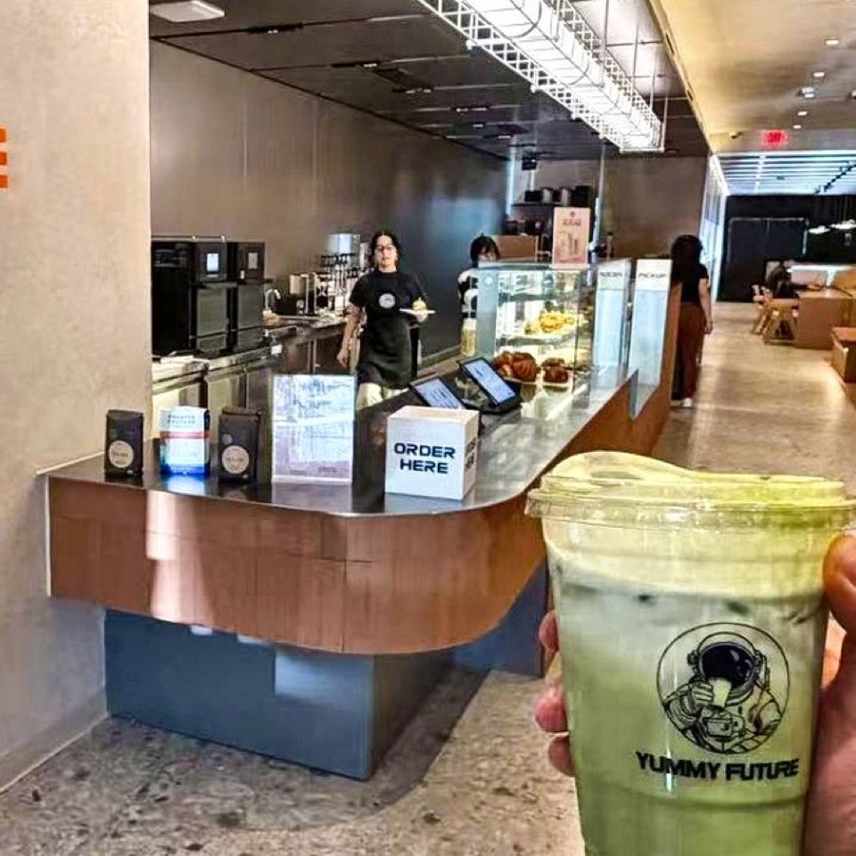 Matcha latte held up at the Palo Alto store